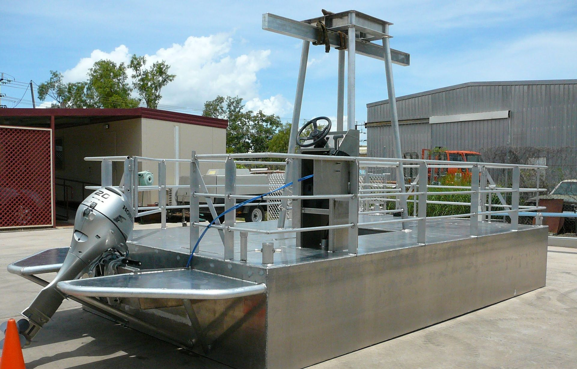 Aluminum Pontoon Boat With Outboard Motor and Overhead Lift Structure — Greville Fabrication in Girraween, NSW