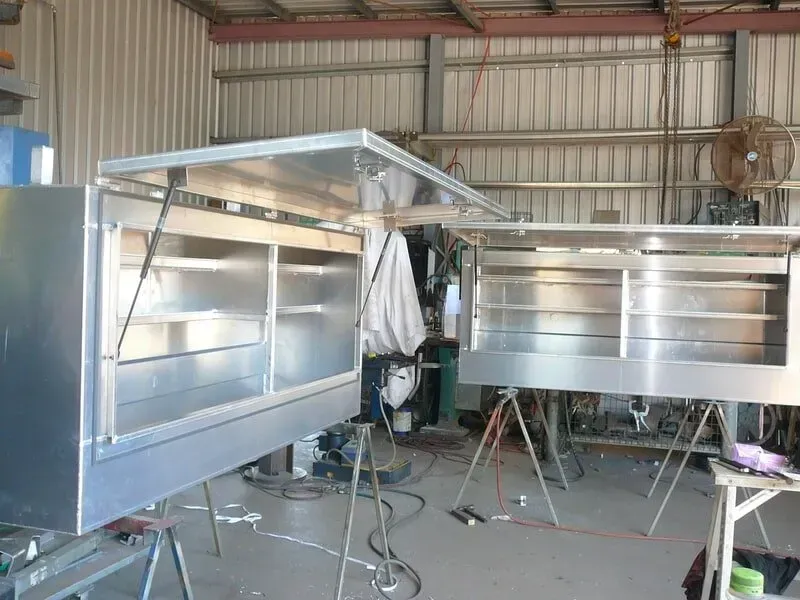 Two Open Metal Toolboxes With Shelves Sit on Stands — Greville Fabrication in Girraween, NSW