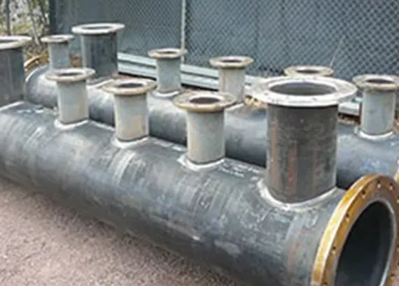 Large Gray Industrial Pipe With Multiple Vertical Vents and a Yellow-rimmed Opening — Greville Fabrication in Girraween, NSW