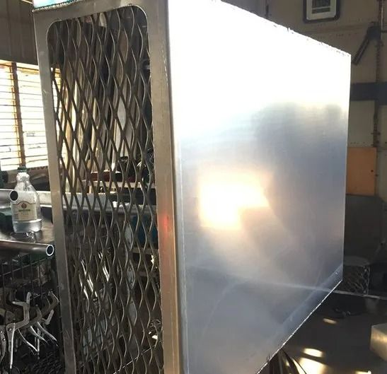 Metallic Rectangular Enclosure With a Metal Mesh Front — Greville Fabrication in Girraween, NSW