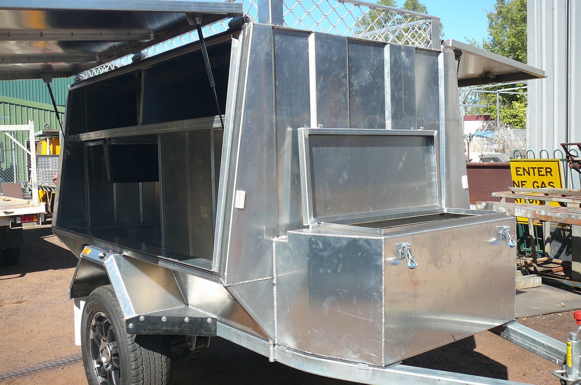 Silver aluminum trailer with compartments and a large storage box — Greville Fabrication in Girraween, NSW