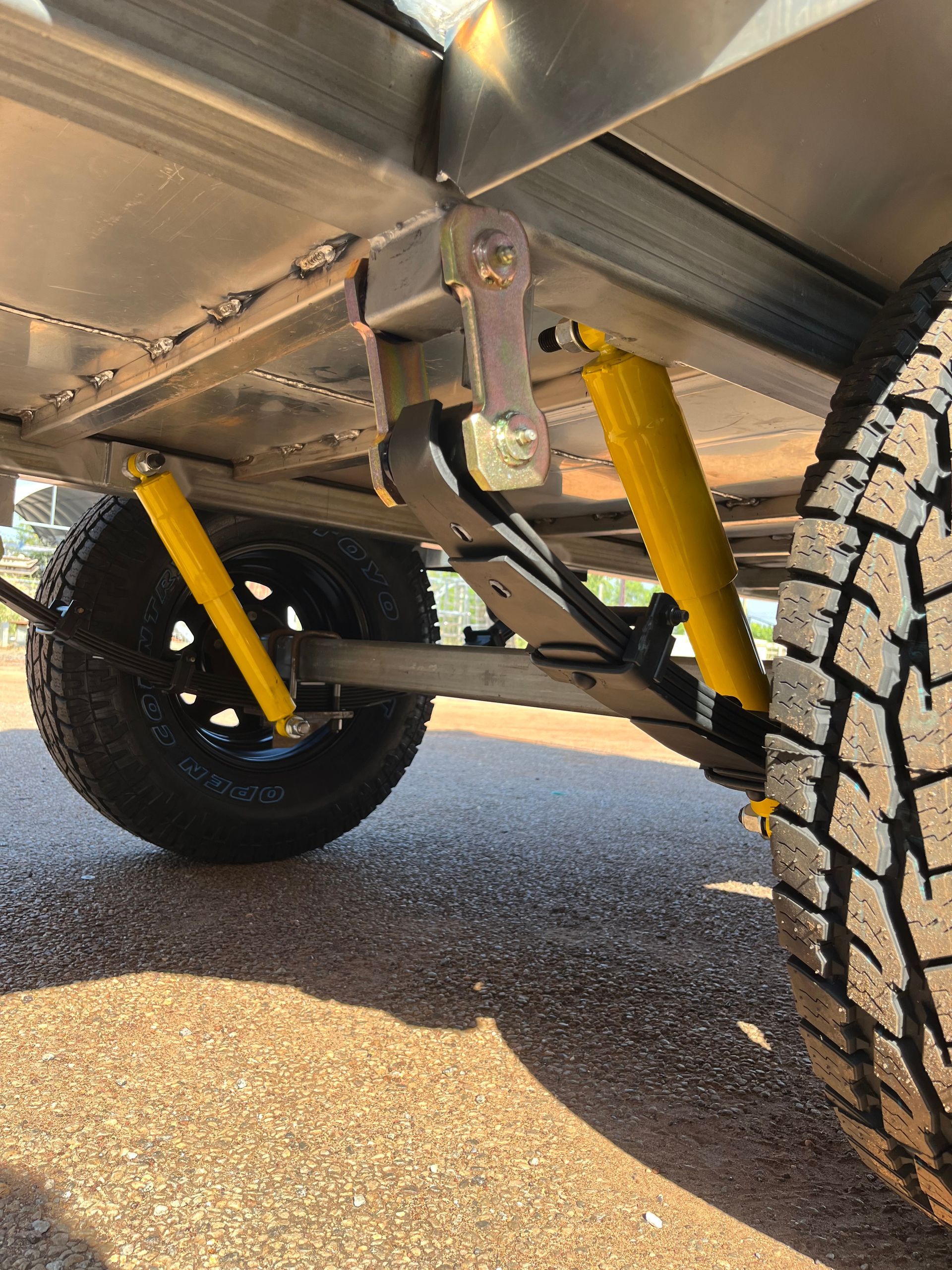 Low-angle View of a Vehicle’s Suspension and Off-road Tires — Greville Fabrication in Girraween, NSW