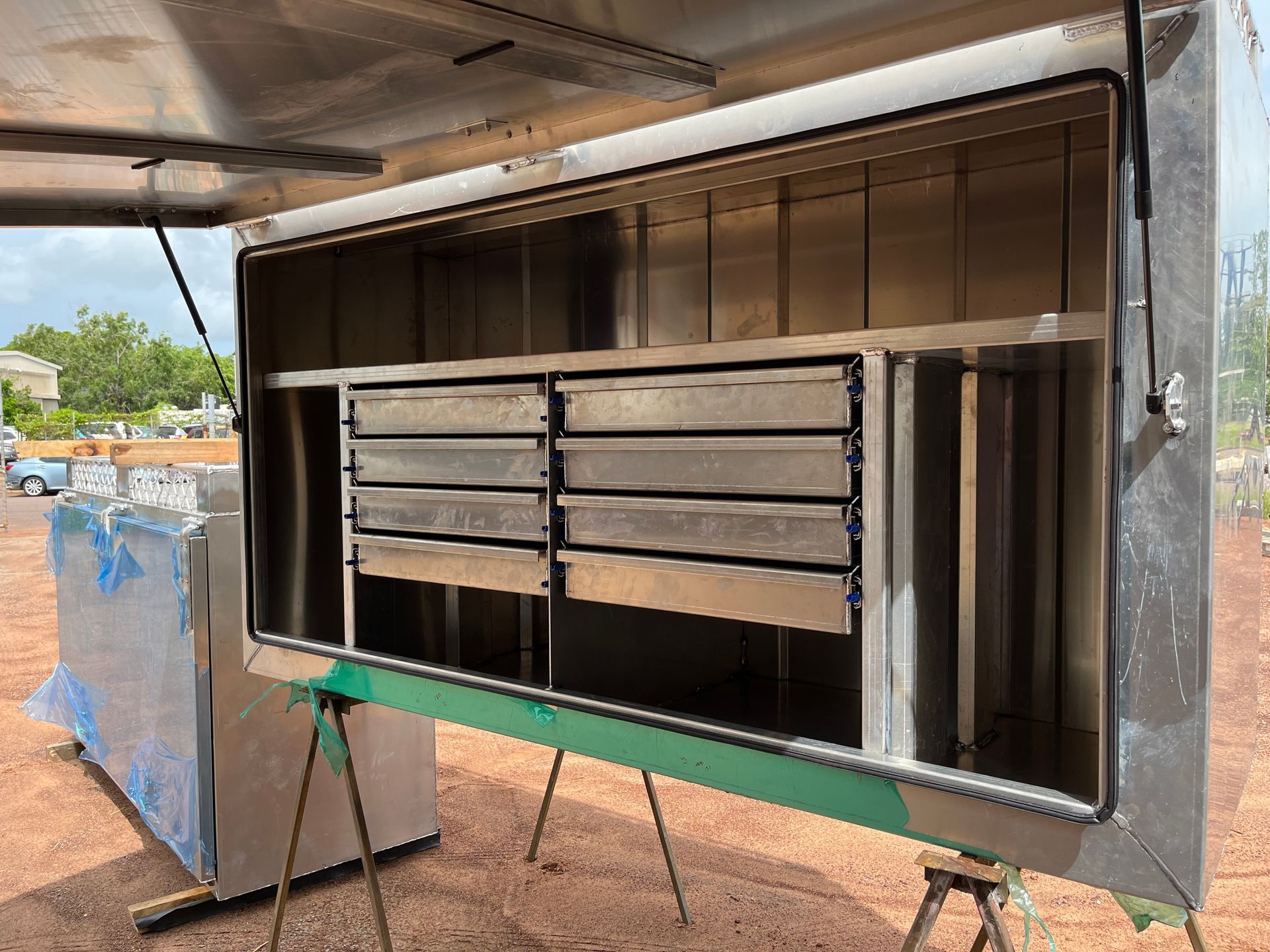 Open Food Truck Window With Metal Shelves and Drawers Inside, Silver Exterior — Greville Fabrication in Girraween, NSW