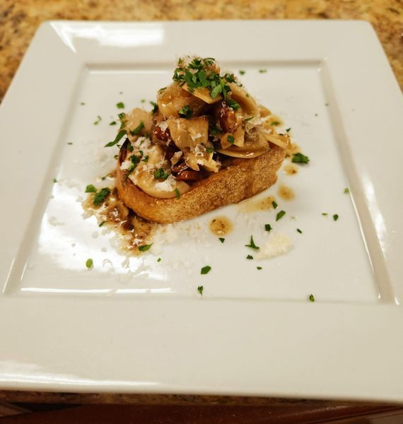 A white plate with a piece of food on it