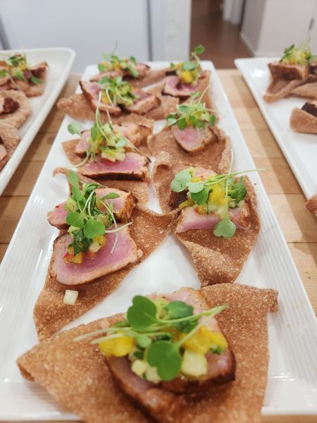 A tray of food with meat and vegetables on it