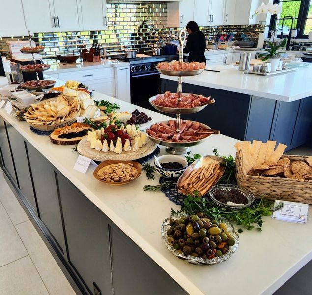 A buffet table with a lot of food on it