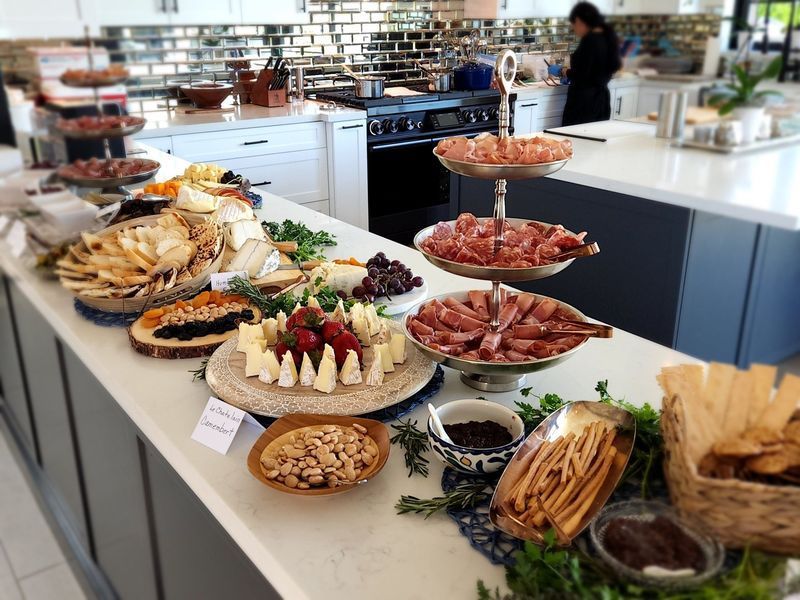 A buffet table with a variety of food on it