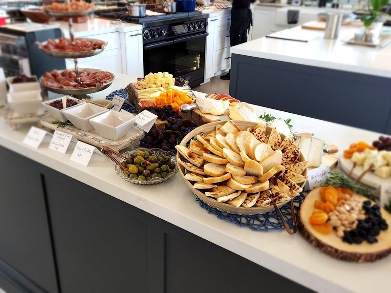 A buffet table with a variety of food on it.