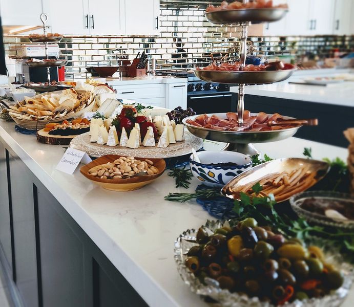 A buffet table with a variety of food on it