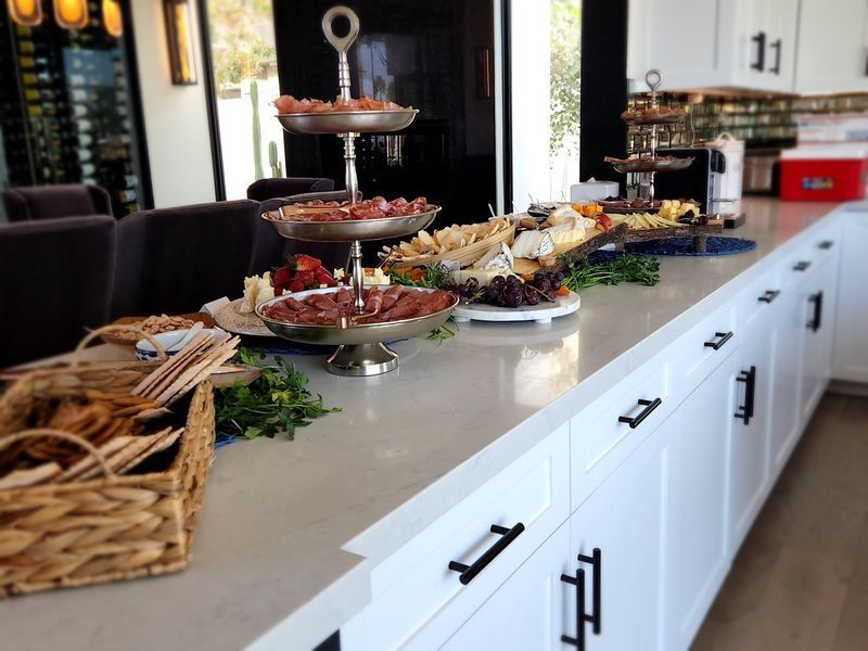 A kitchen counter with a variety of food on it