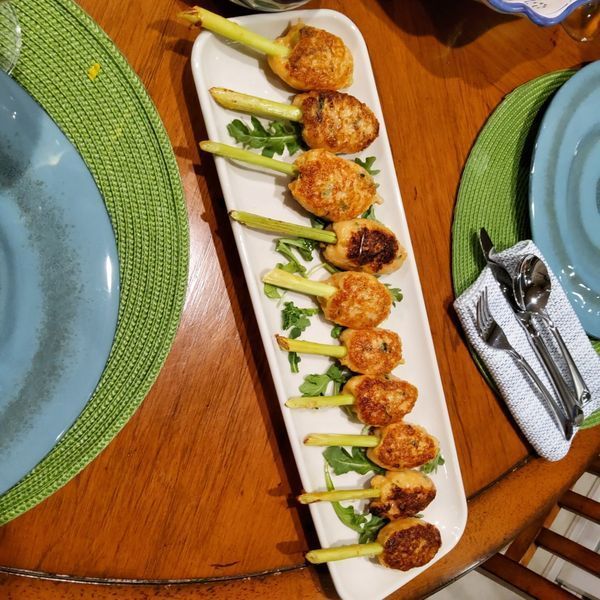 A plate of food on a table with plates and silverware