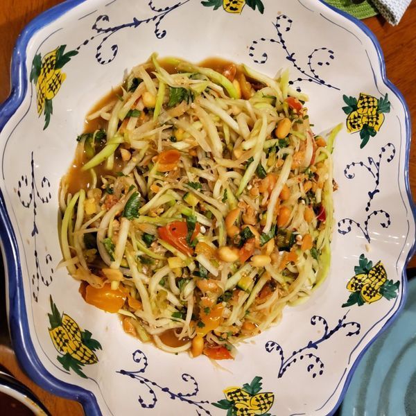 A bowl of noodles with pineapples on it