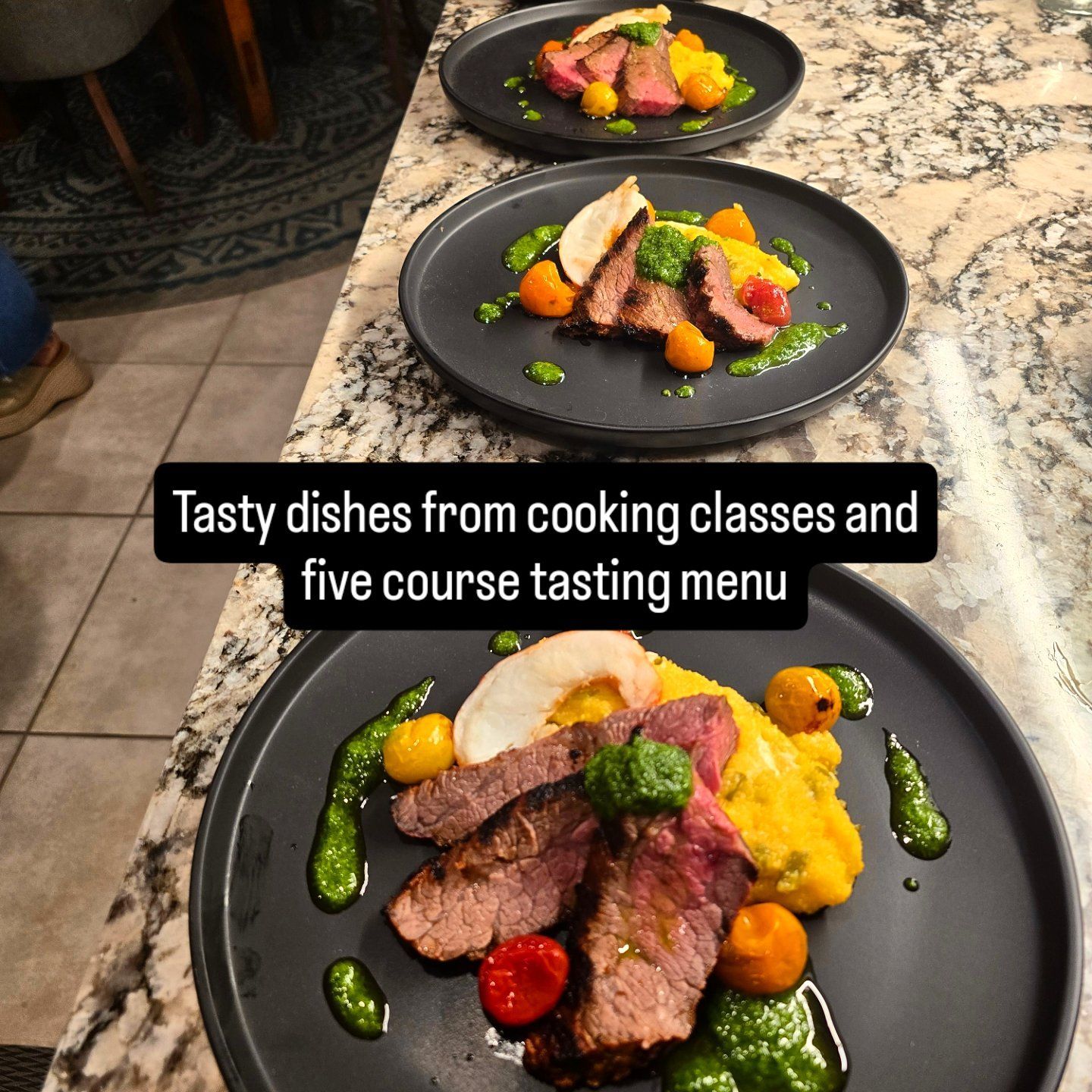 Three plates of steak, colorful vegetables, and sauce arranged artistically on a countertop.
