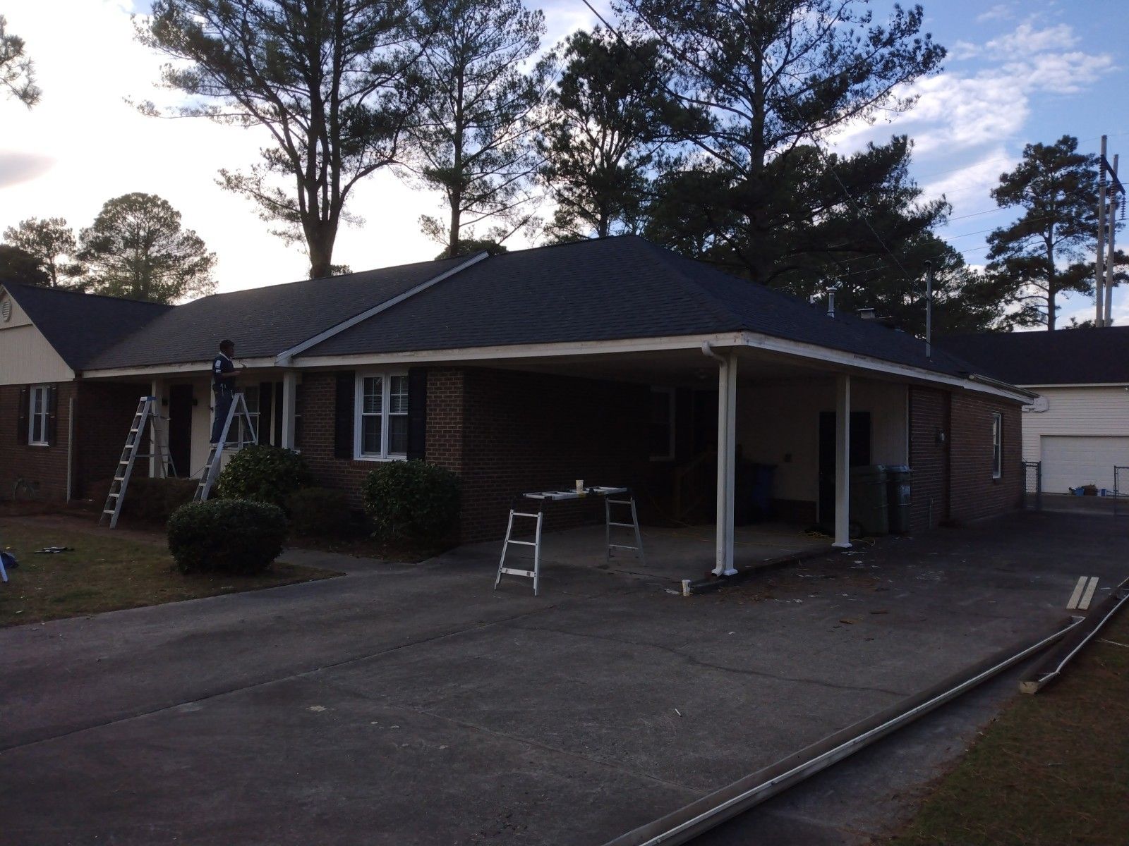 Workers replacing the wood rot