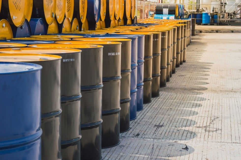 A Row of Barrels Are Lined Up in a Warehouse — Payton Civil Products in Wilsonton, QLD