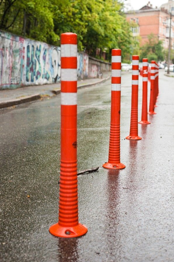 A Row of Orange and White Traffic Poles — Payton Civil Products in Wilsonton, QLD