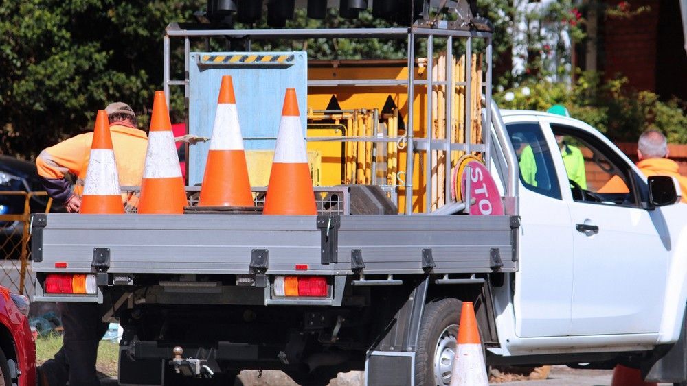 A Truck With Traffic Cones on the Back — Payton Civil Products in Kingaroy, QLD