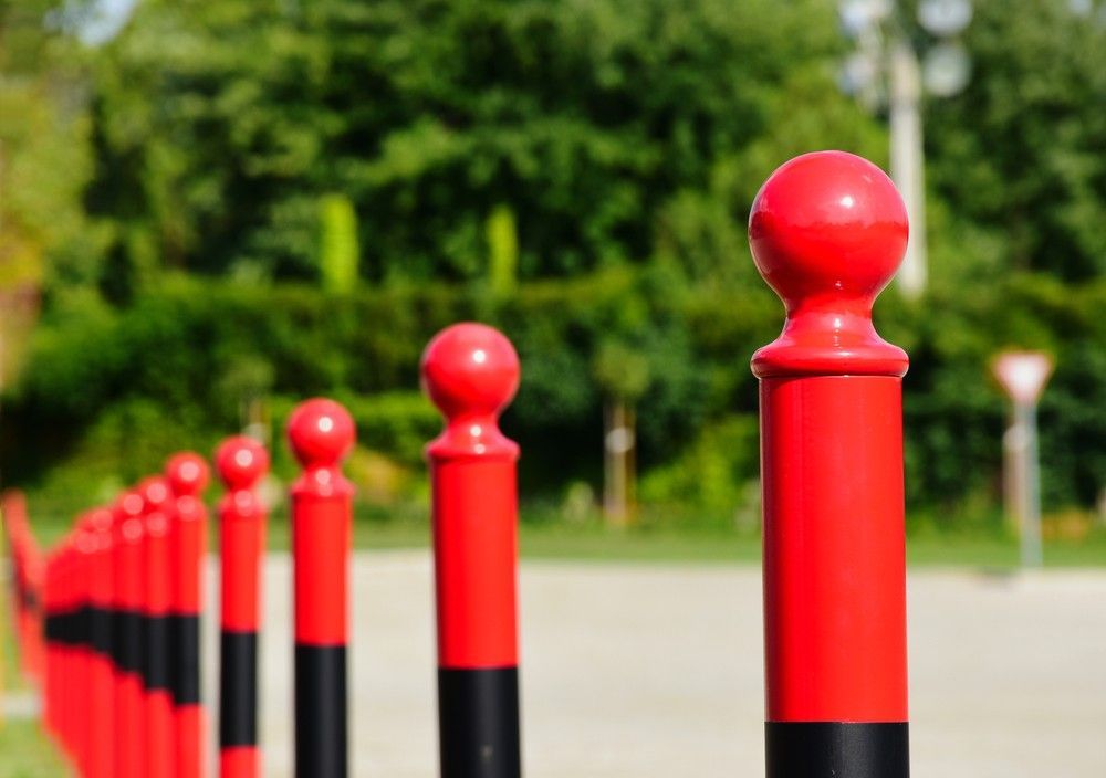 A Row of Red and Black Poles in a Park — Payton Civil Products in Warwick, QLD
