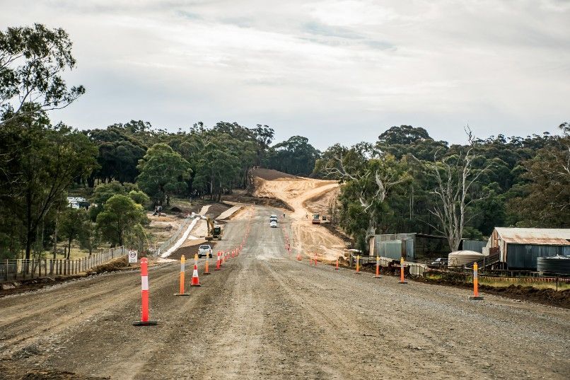 A Dirt Road With a Lot of Traffic Cones on It — Payton Civil Products in Dalby, QLD