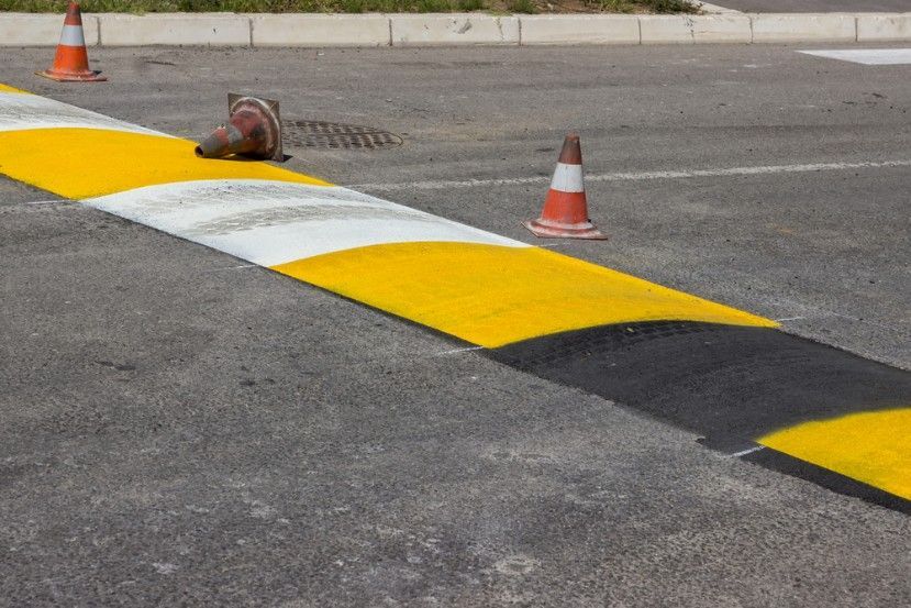 A Yellow and Black Speed Bump in a Parking Lot — Payton Civil Products in Kingaroy, QLD