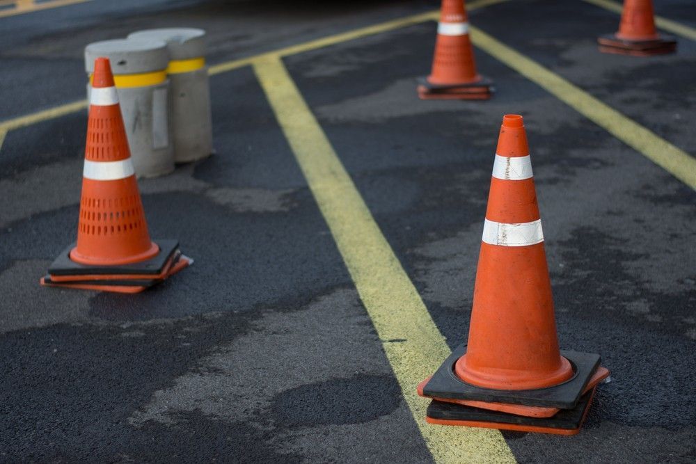 A Row of Orange Traffic Cones Are Sitting on the Ground — Payton Civil Products in Dalby, QLD