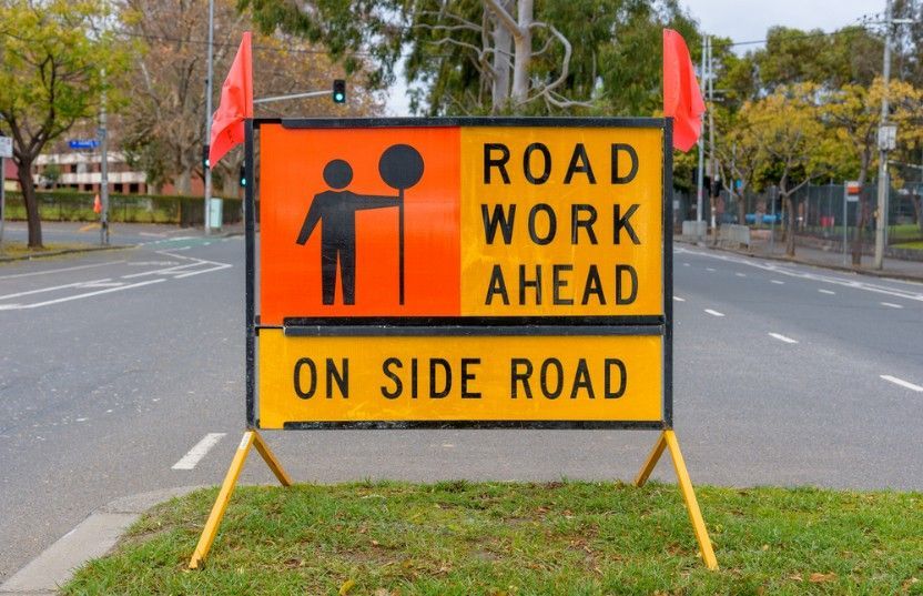 A Sign That Says Road Work Ahead on Side Road — Payton Civil Products in Kingaroy, QLD