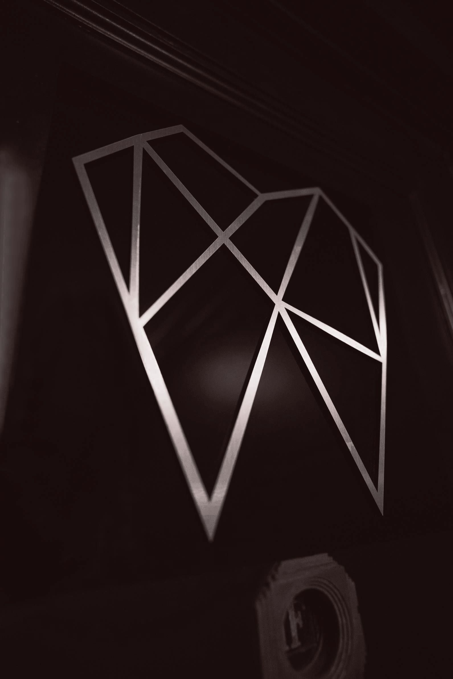 A diamond made of triangles on a black background
