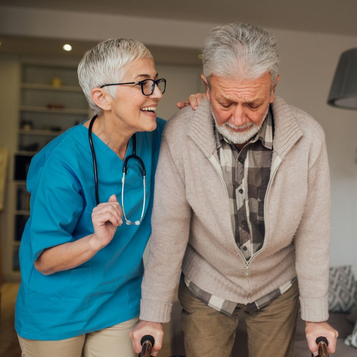 A nurse is helping an elderly man walk with canes.