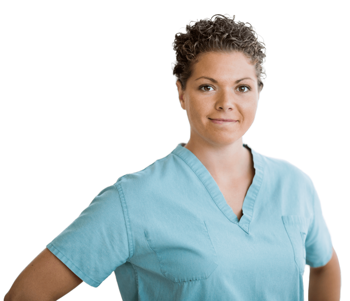 A woman in a blue scrub top stands with her hands on her hips