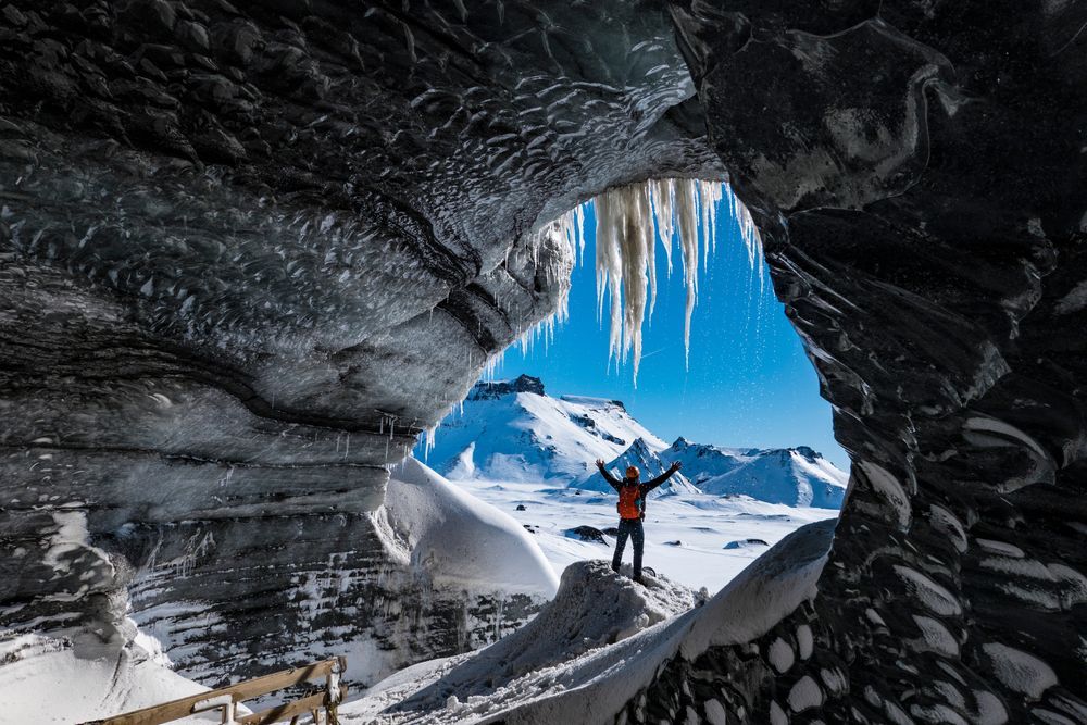 Person standing in an Ice Cave in Iceland