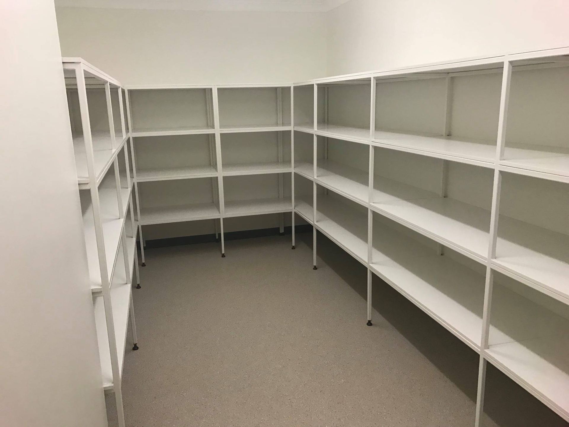 A Room With A Lot Of Shelves And A Carpeted Floor β Bullant Building In Ciccone, NT