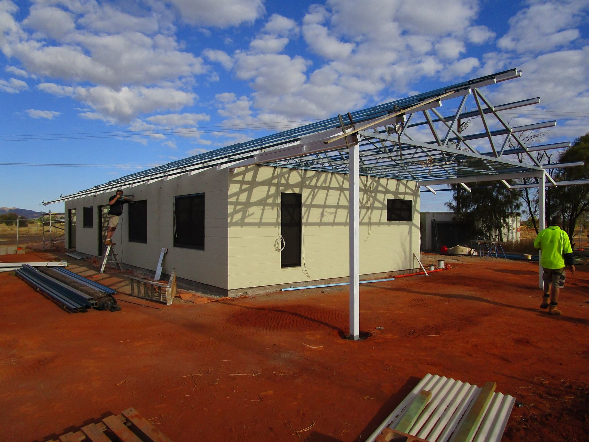 A Man Is Standing In Front Of A Building Under Construction β Bullant Building In Ciccone, NT