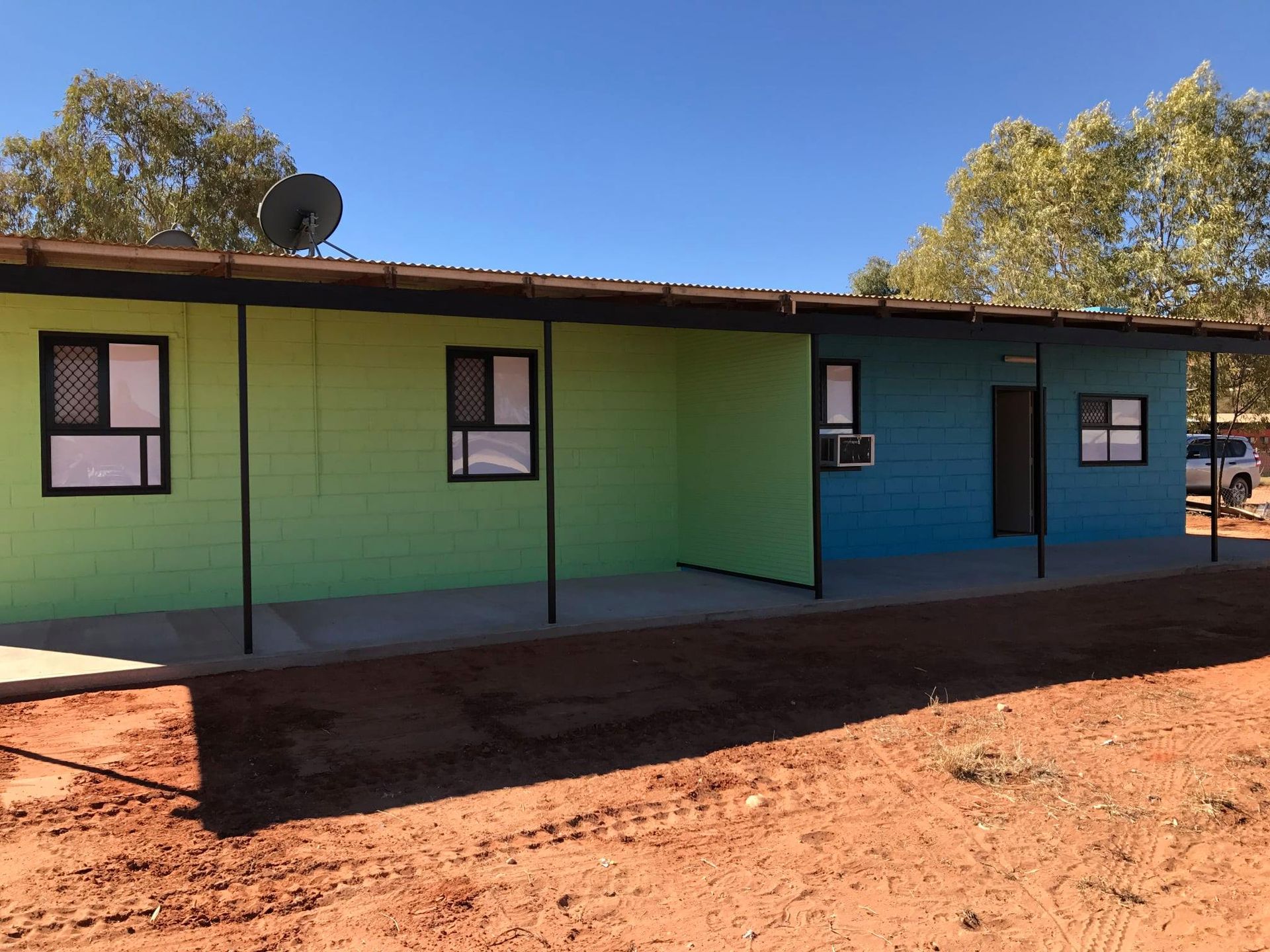 A Blue And Green Building With A Satellite Dish On The Roof β Bullant Building In Ciccone, NT