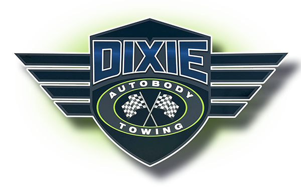 A dixie autobody towing logo with checkered flags on it
