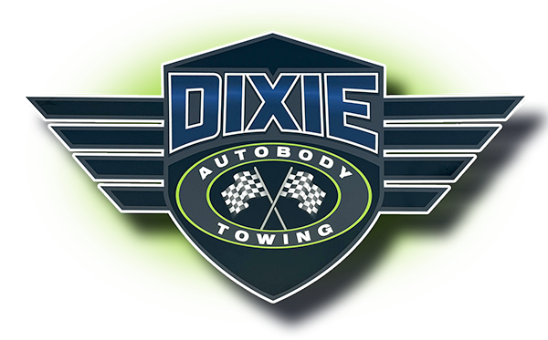 A dixie autobody towing logo with a checkered flag on it