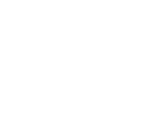 A hand holds a brown-and-white patterned ceramic mug against a blurred background of green plants.