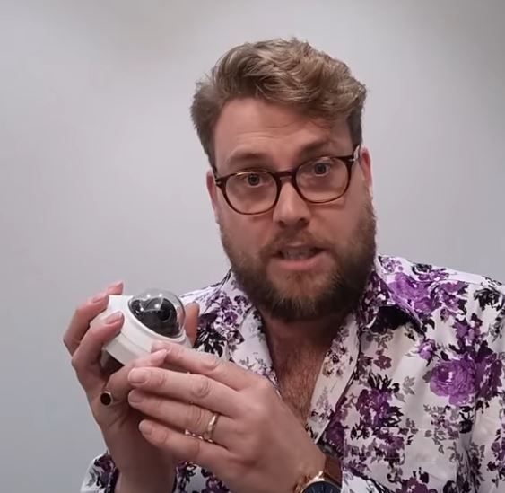 Engineer explaining video edge recording using an IP camera with micro SD storage for resilient VMS 