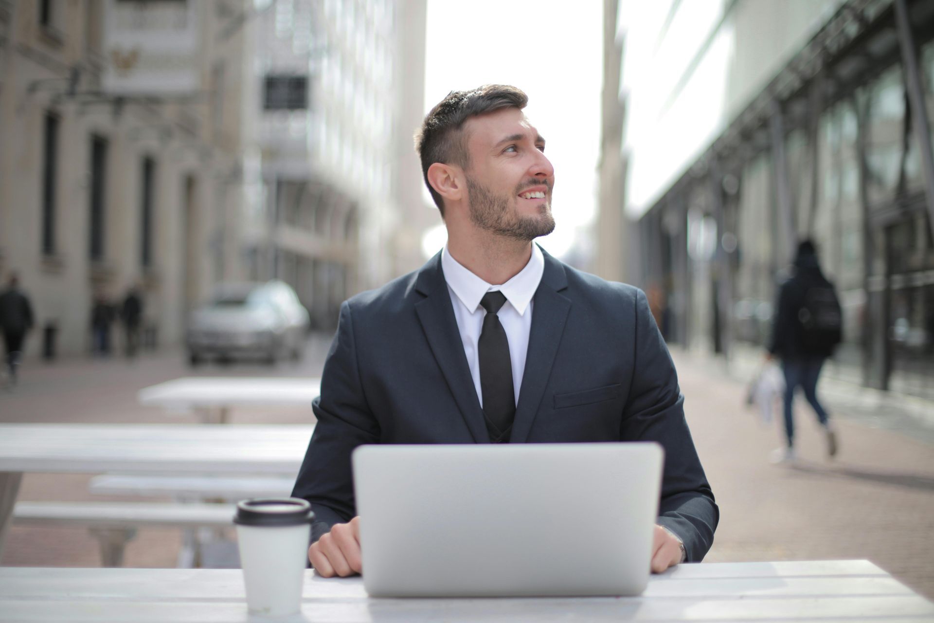 Business professional using WiFi-enabled laptop in a modern workplace environment