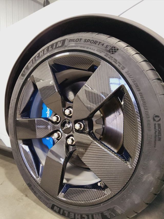 A close up of a car wheel with a mercedes logo on it