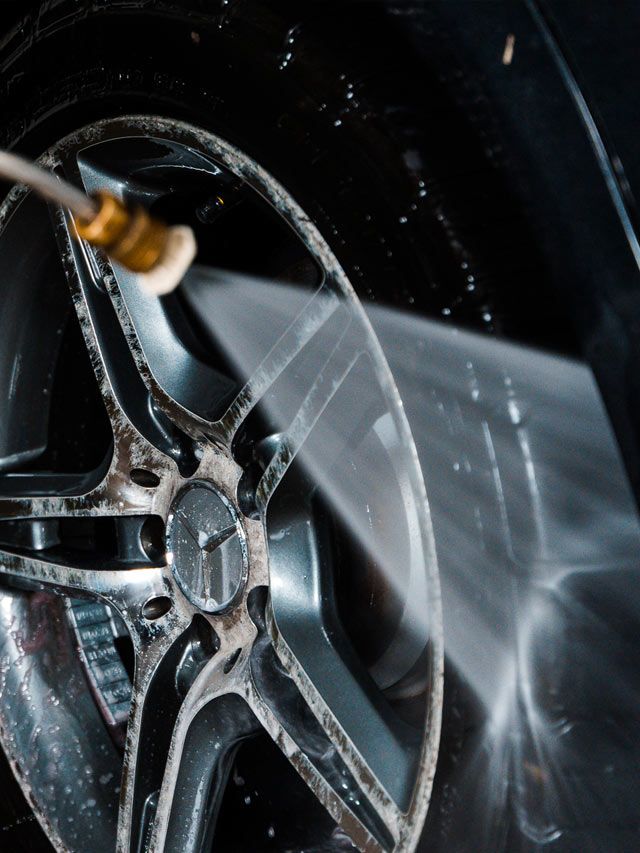 A close up of a car wheel with a mercedes logo on it