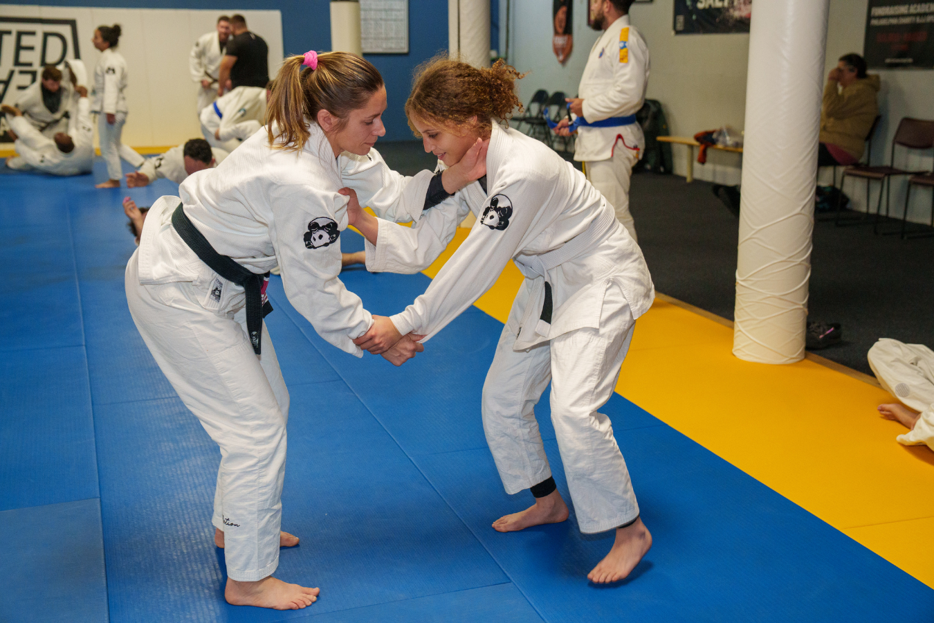Students train jiu jitsu mobility drills at Inverted Gear Academy in Bethlehem, PA for safer hips and shoulders. 