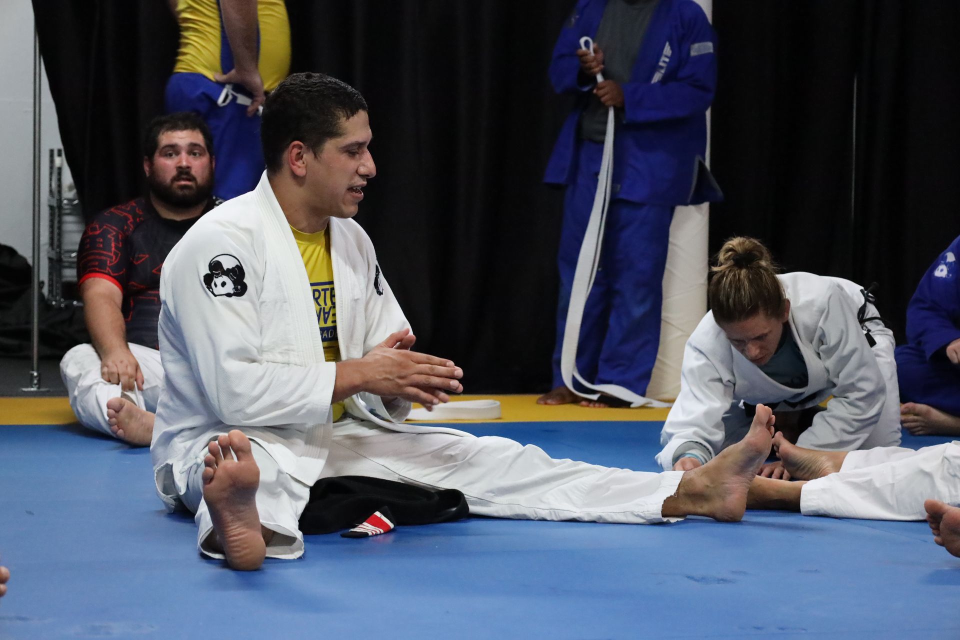 BJJ student practicing flexibility techniques during class at Inverted Gear Academy in Bethlehem PA to improve mobility and control.