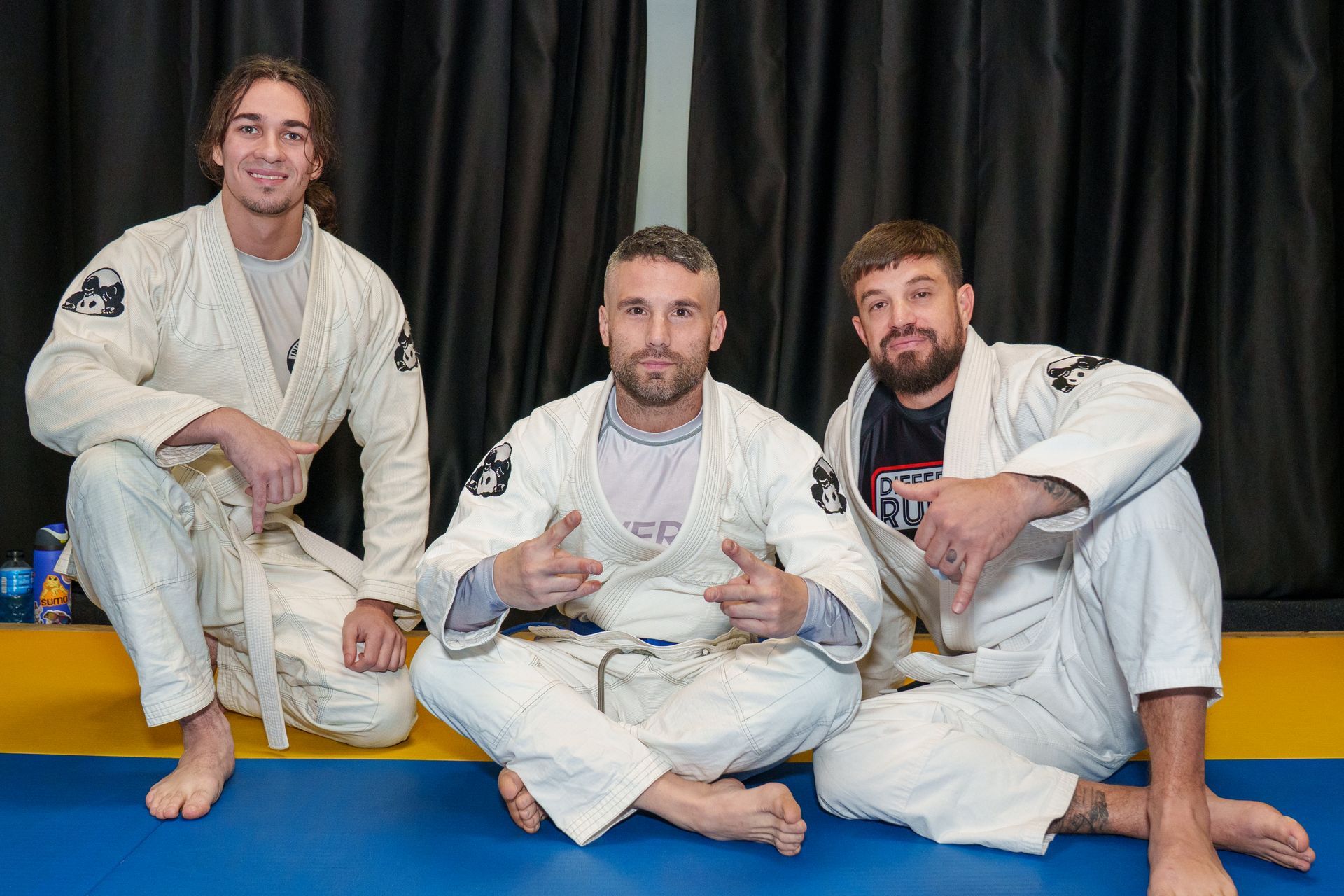 Adults practicing controlled grappling at Inverted Gear Academy in Bethlehem, PA, building confidence and self-defense skills.
