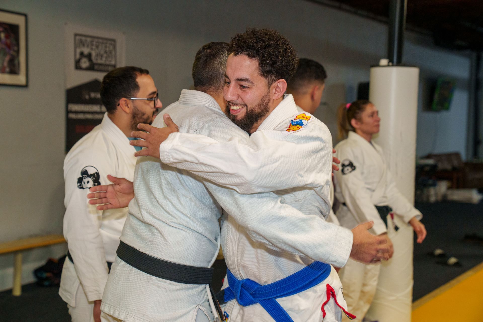 Adults drilling Brazilian jiu jitsu techniques at Inverted Gear Academy in Bethlehem, PA, building fitness and community.