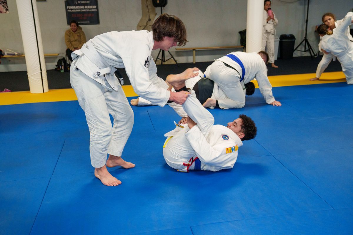Adults drilling Brazilian Jiu-Jitsu fundamentals at Inverted Gear Academy in Bethlehem, PA for fitness and confidence.