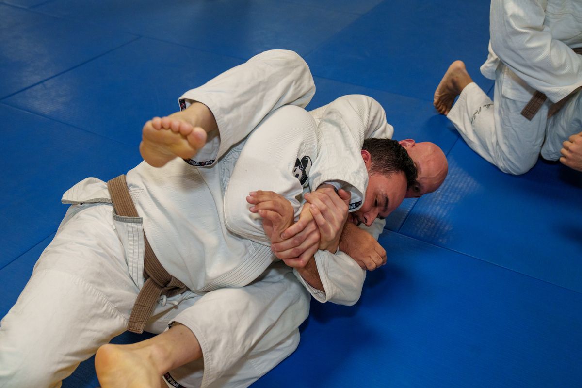Adults drilling jiu jitsu techniques at Inverted Gear Academy in Bethlehem, PA to build focus.