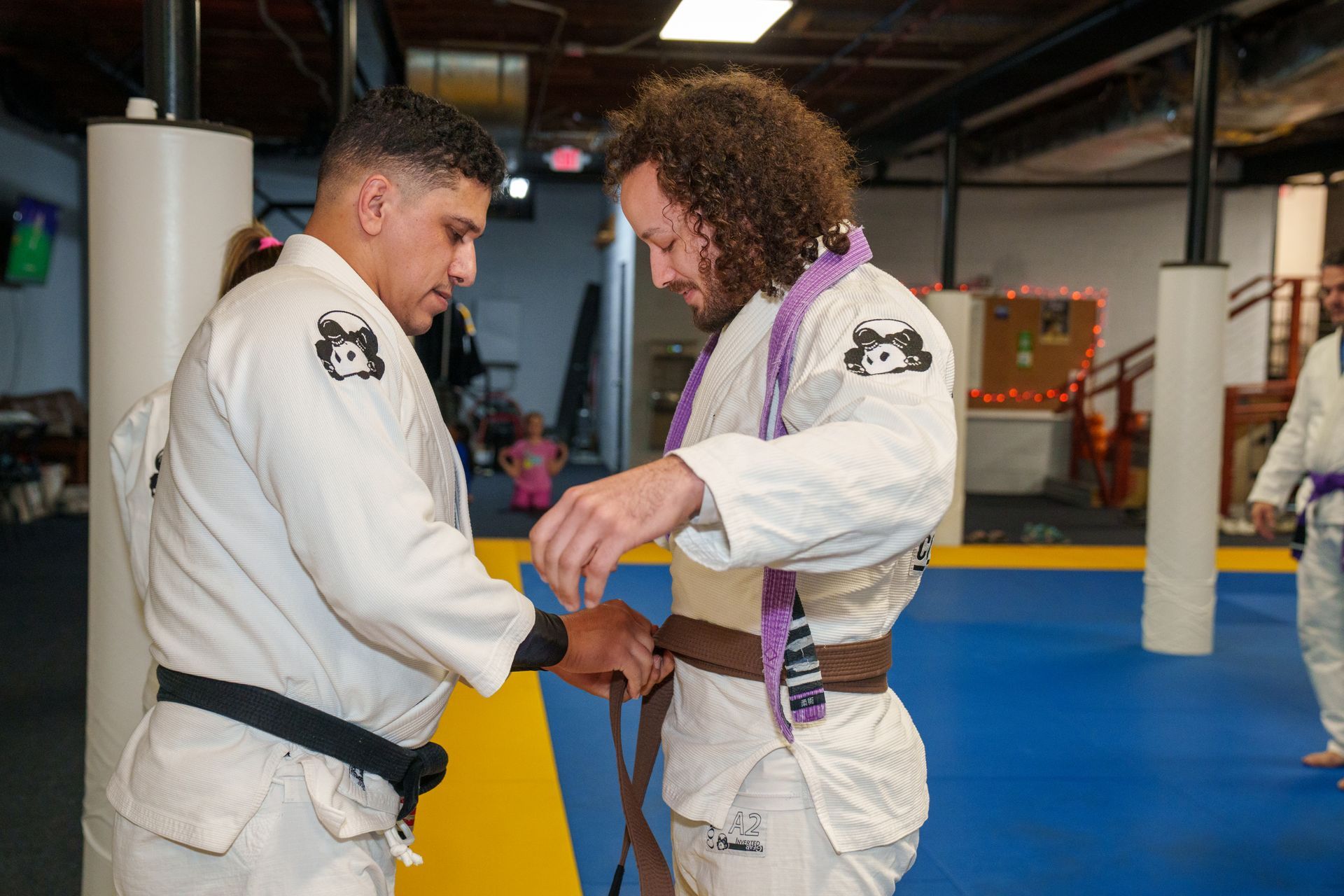 Adults training Brazilian Jiu-Jitsu at Inverted Gear Academy in Bethlehem, PA, building calm focus.