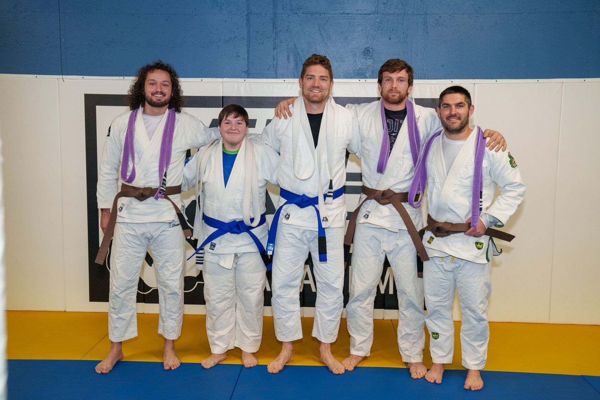 Students practicing Brazilian Jiu-Jitsu techniques at Inverted Gear Academy in Bethlehem PA during all-ages class
