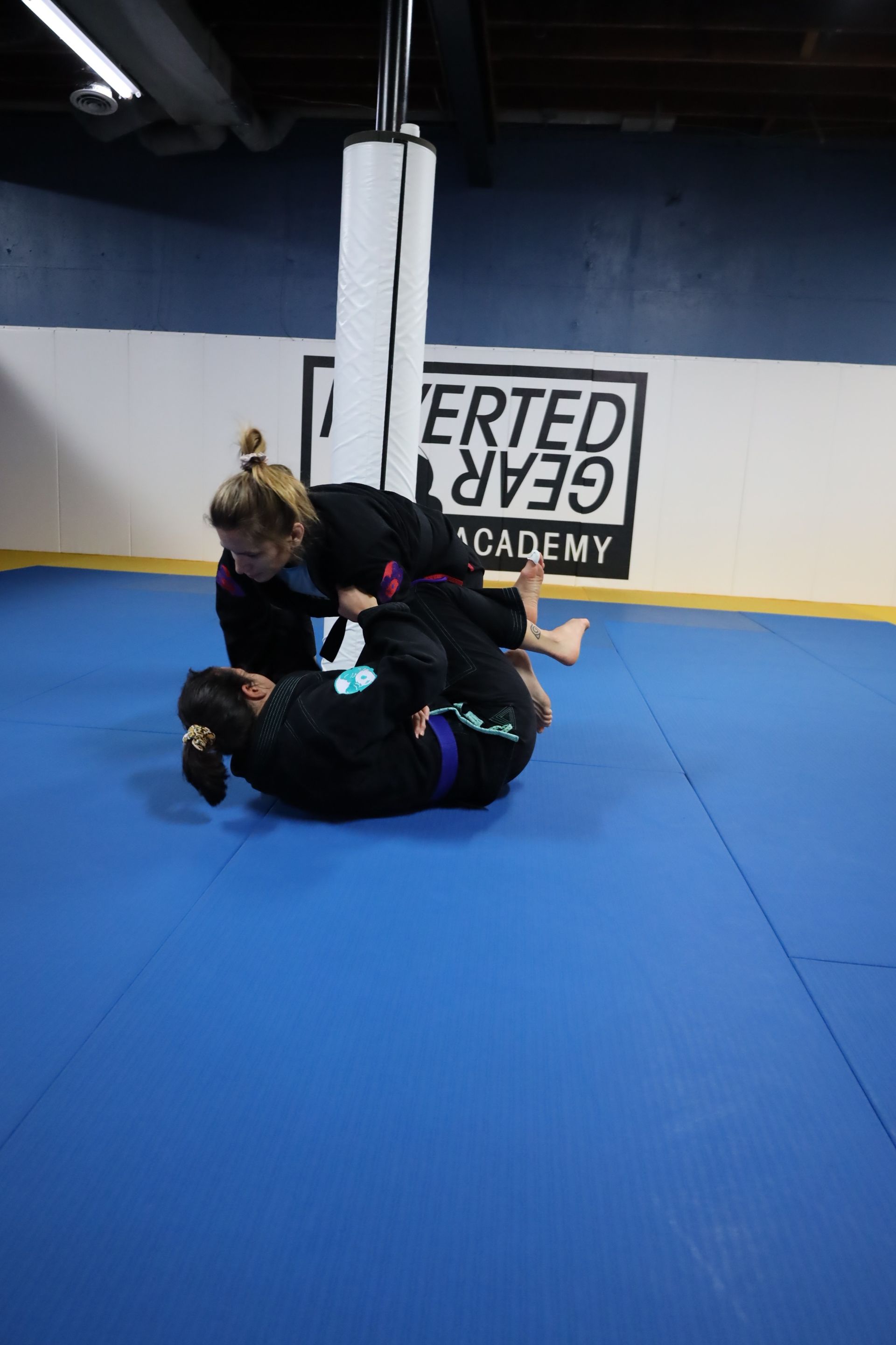 Adults practicing Brazilian jiu-jitsu techniques at Inverted Gear Academy in Bethlehem PA for stress relief and fitness
