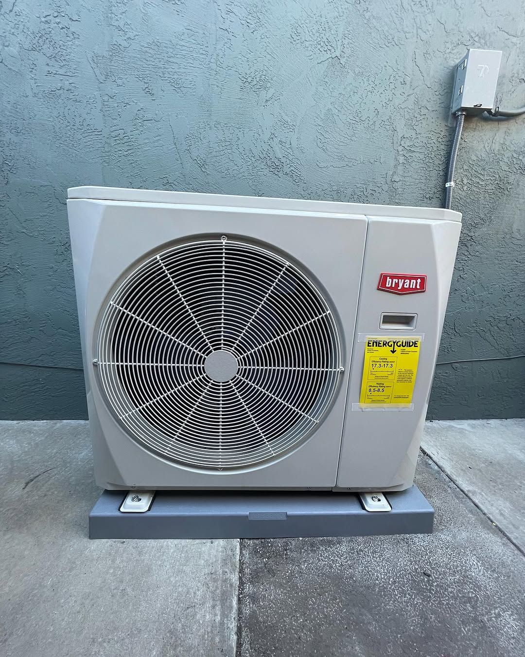 A fan with a yellow sticker on it that says ' ypac ' on it